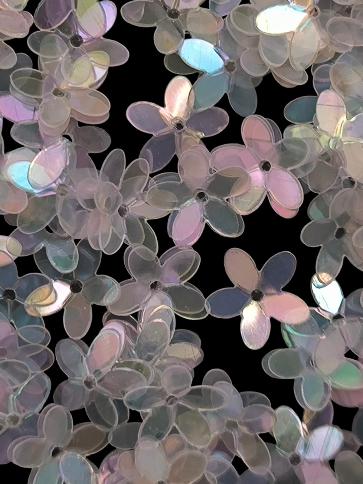 Paillettes petites fleurs blanc transparent irisé bleu rose 9 mm