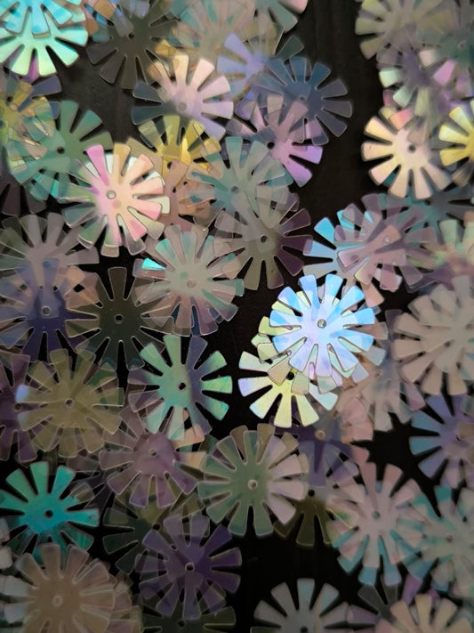Paillettes fleurs soleil transparent blanc irisé 15 mm