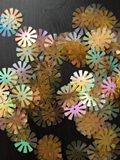 Paillettes fleurs soleil orange transparent 15 mm
